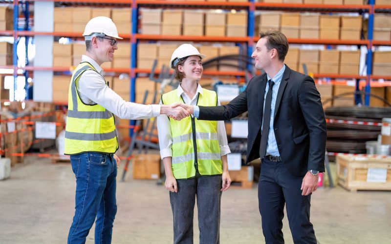 Employer shaking hands with new temporary hires